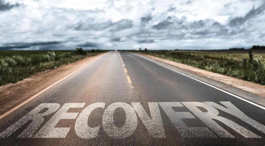 Addiction Counseling in Chicago: Professional Support for Lasting Recovery 3 Road to recovery with 'RECOVERY' written in bold white letters, symbolizing the journey of addiction counseling in Chicago under a cloudy yet hopeful sky.