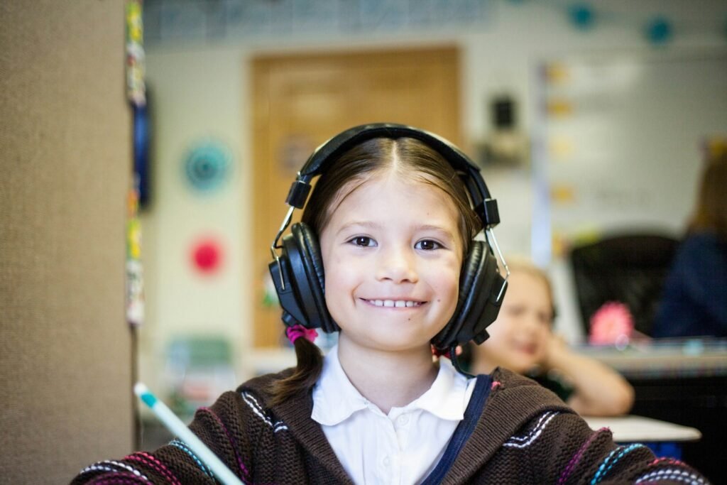 Nurture Their Growth: 7 Transformative Benefits of Child Therapy in Chicago 4 girl wearing black headphones: Child Therapy
