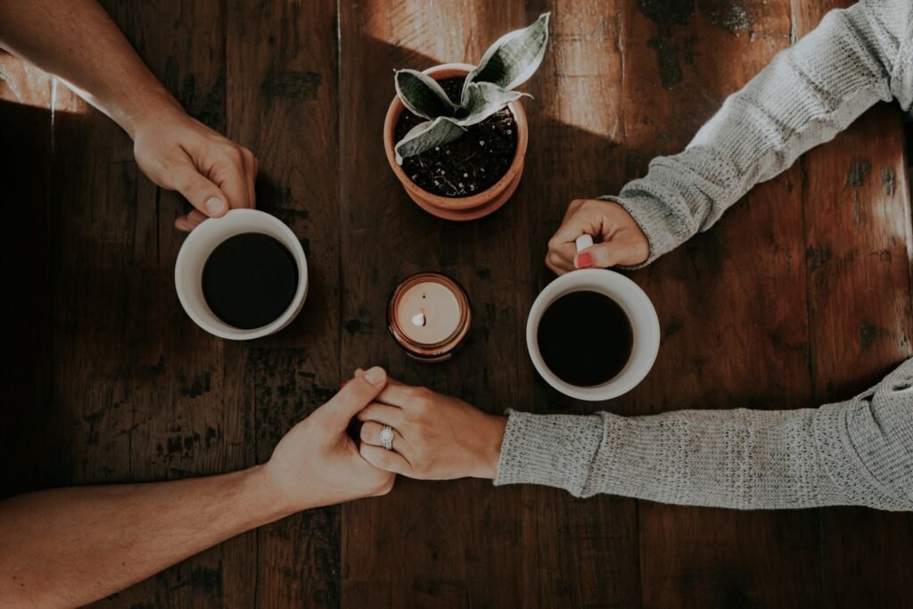 Ignite Your Love: 7 Transformative Benefits of Couples Counseling in Chicago 8 person holding white ceramic mugs: couples counseling