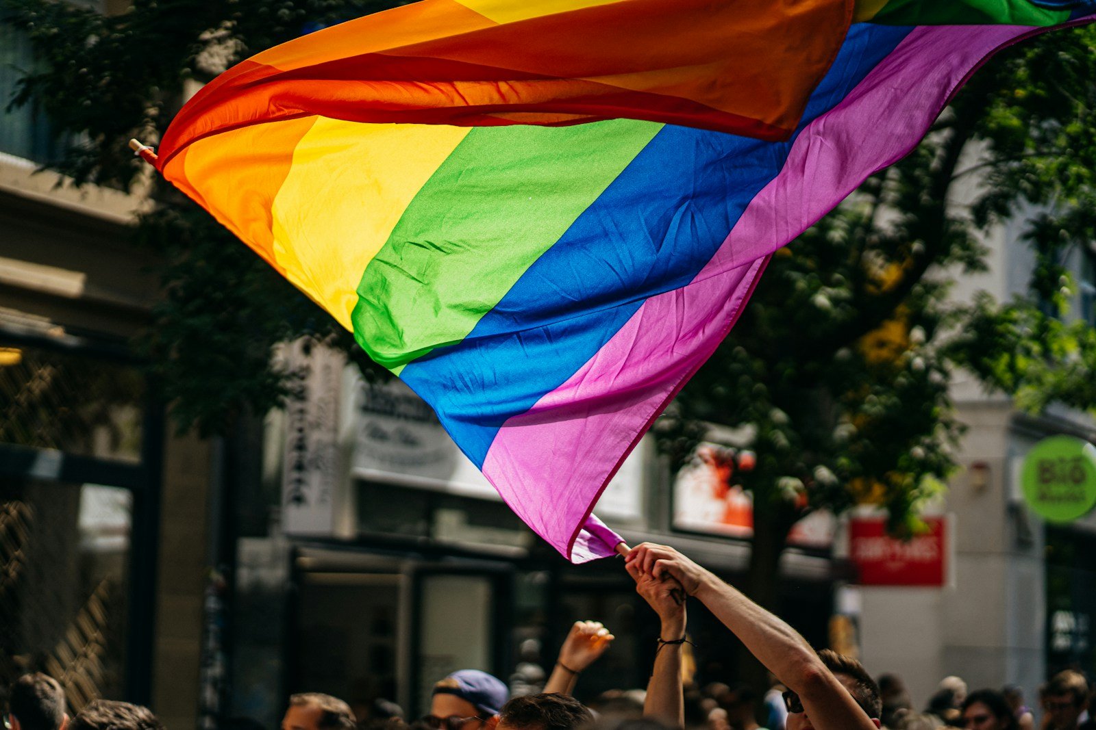 people holding flags during daytime: LGBTQ therapy