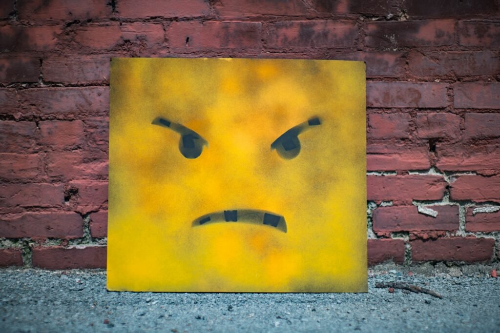 Master Your Emotions: Transformative Benefits of Anger Management Therapy in Chicago 1 yellow and black smiley wall art: Anger Management Therapy